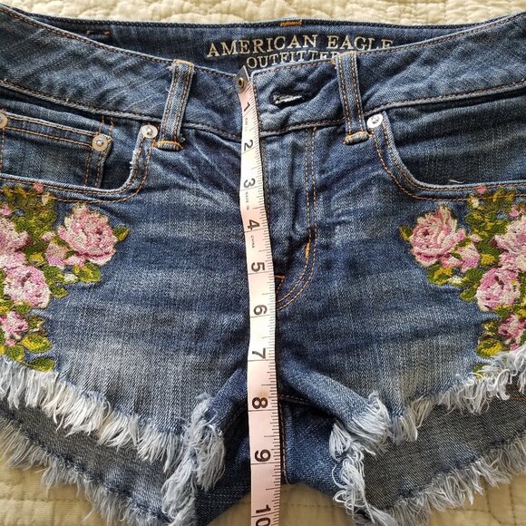 AMERICAN EAGLE Low Ride Raw Hem Embroidered Floral Denim Shorts - Picture 6 of 8